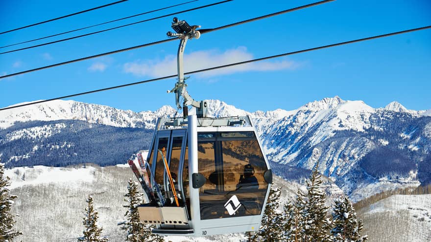 Ski lift heads uphill on snowy Vail, Colorado mountain