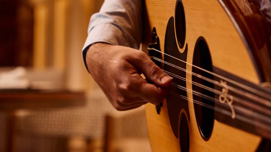 Close up of a hand strumming a guitar