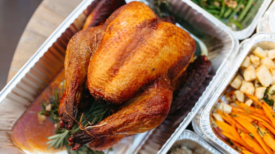 Various Thanksgiving food in trays.