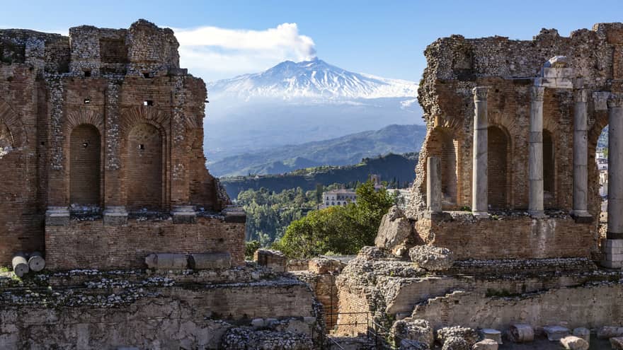 Ancient theatre in Taormina, Sicily, and Mount Etna in the distance