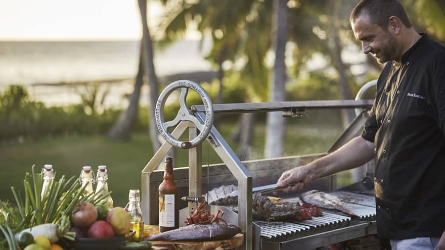 Executive Chef Richard Polhemus flips ribs, fish on outdoor barbecue grill