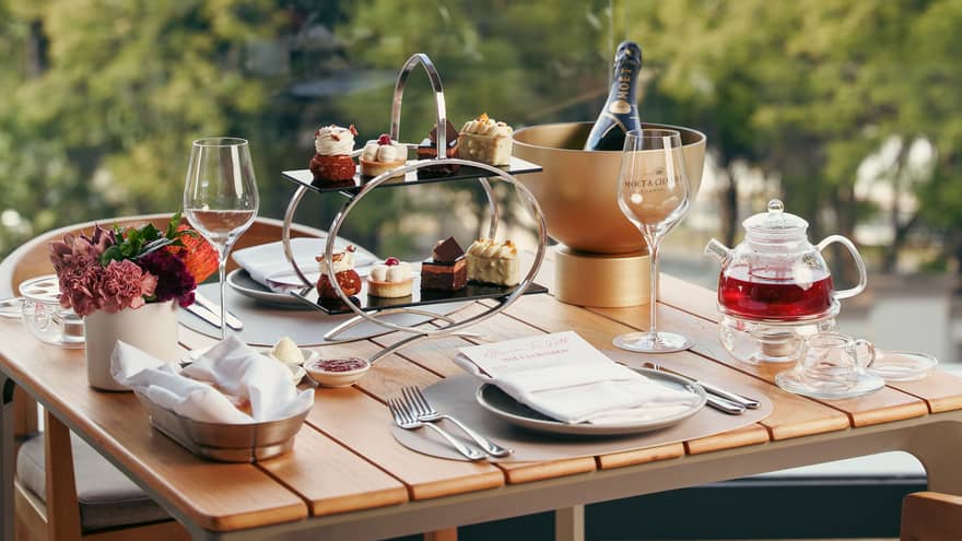 Afternoon Tea set on an outdoor table with garden views