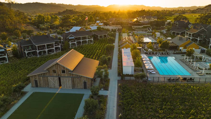Aerial view of Four Seasons Resort Napa Valley grounds, including pool and vineyards