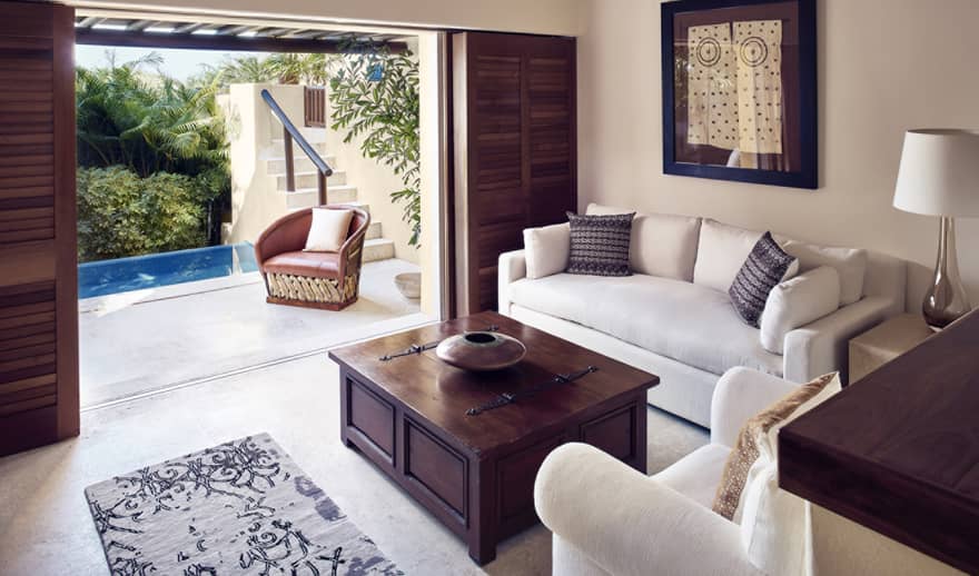 Living room with sofa, arm chair and walk-out terrace