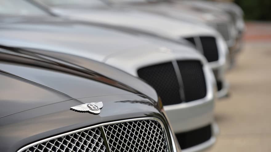 Close up of Bentley car, as part of line up of luxury cars 