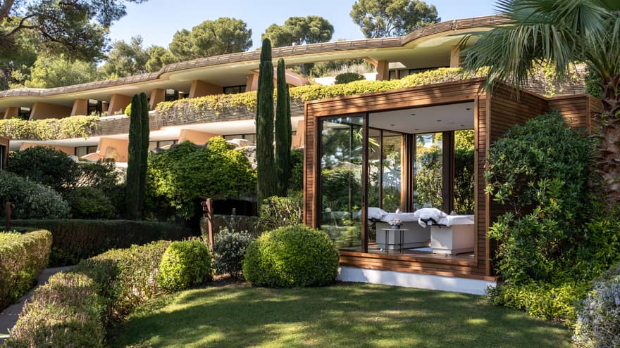 An outdoor spa treatment space set in a verdant landscape