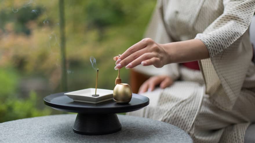 Woman burning incense