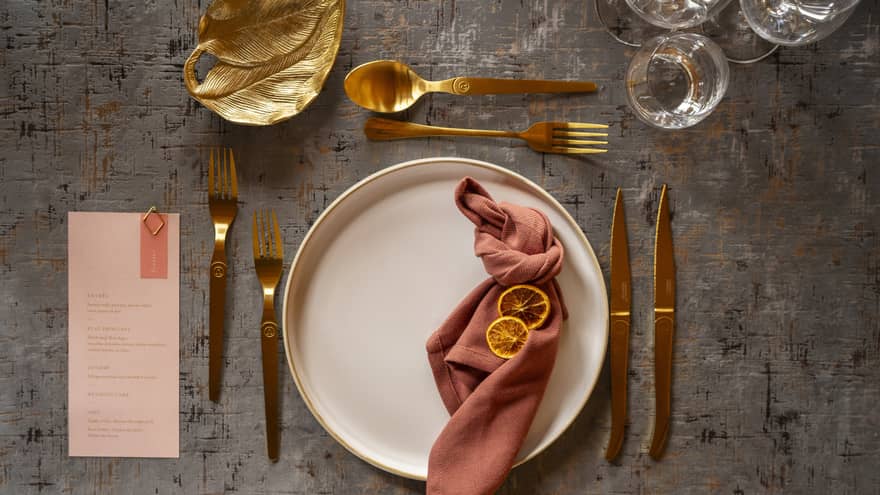 Single wedding formal table setting in burnished tones