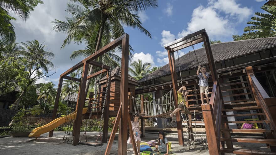 Kids playing on the play set in the kids club at Four Seasons Langkawi