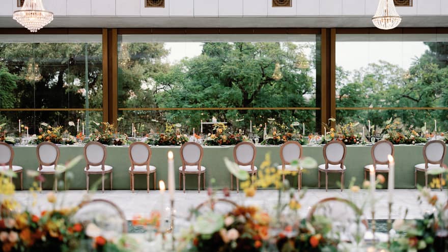 Long wedding table with a view of trees outside
