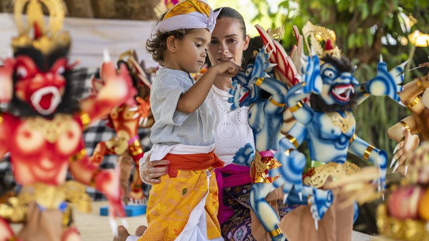 Adult and young child in cultural dress