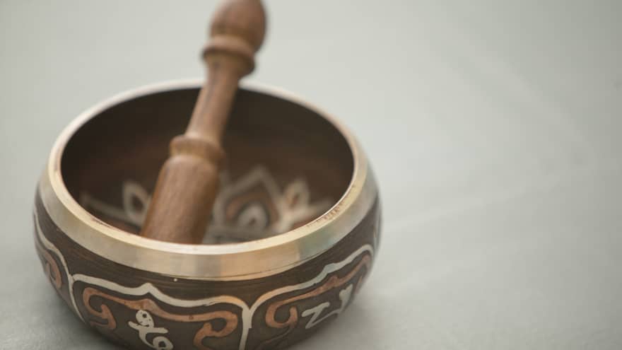 Small copper and wood bowl with decorative design, wood pestle