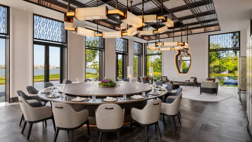 Large 15-person private dining table at luxury hotel restaurant