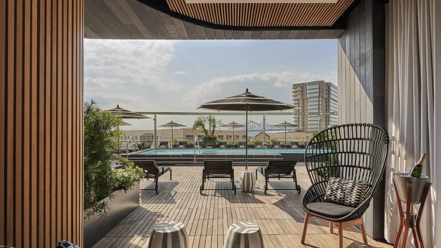 A cabana near an outdoor pool.