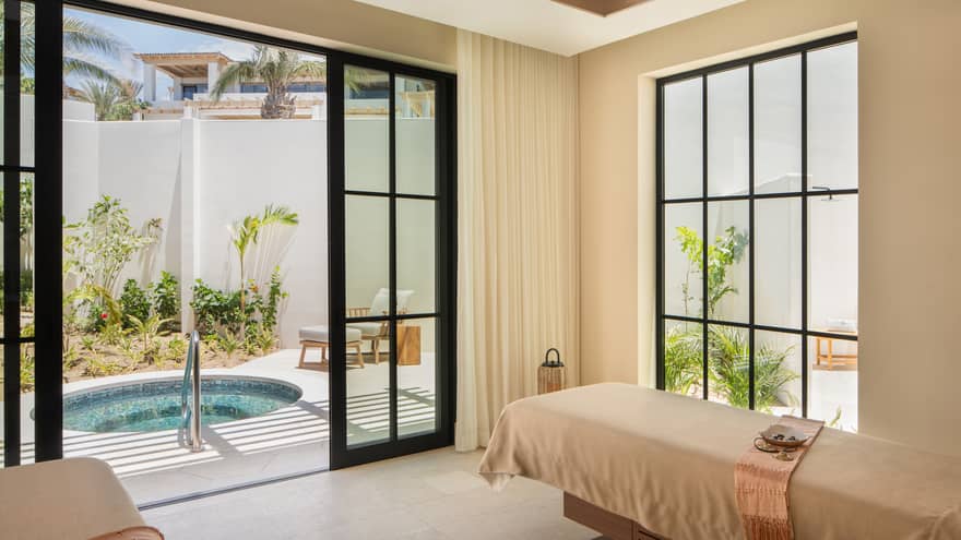 Luxury spa treatment room with access to private outdoor tub at Four Seasons Resort Cabo San Lucas at Cabo Del Sol