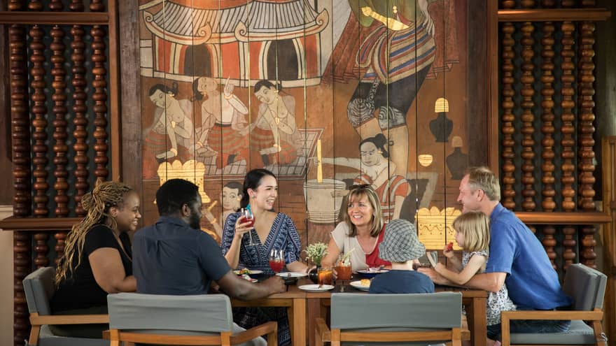 A family dines at restaurant table