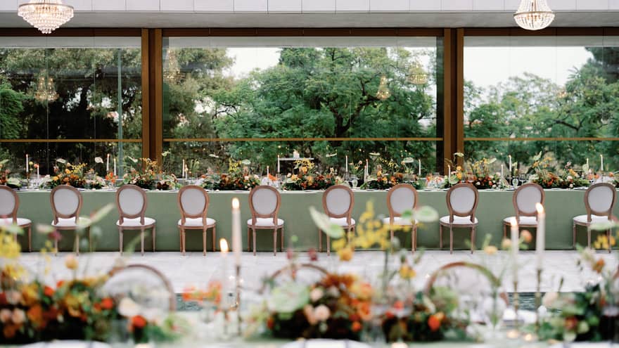 Long wedding table with a view of trees outside