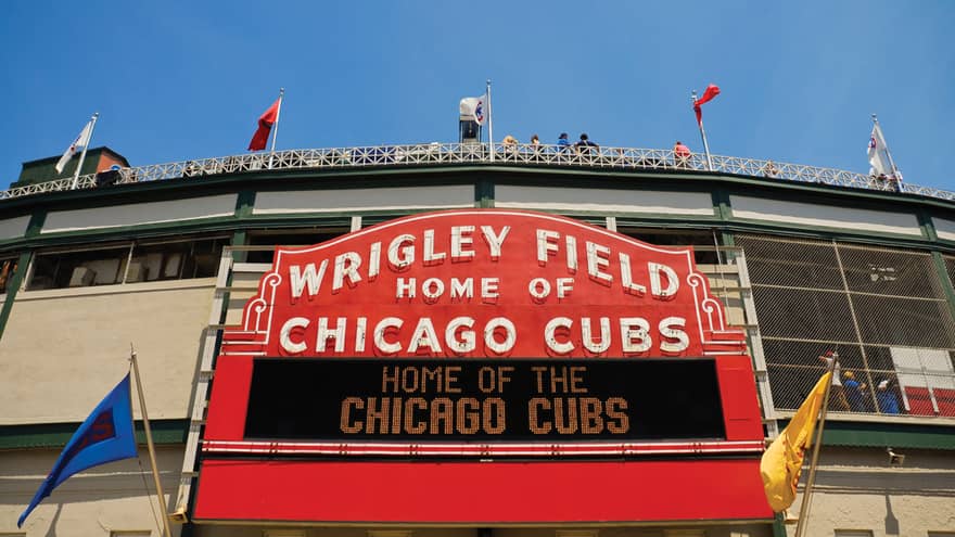 Red stadium sign with name Wrigley Field Home of Chicago Cubs