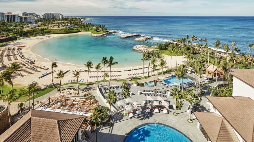 Aerial view of Four Seasons Oahu Resort rooftops, outdoor pool, beach and lagoon