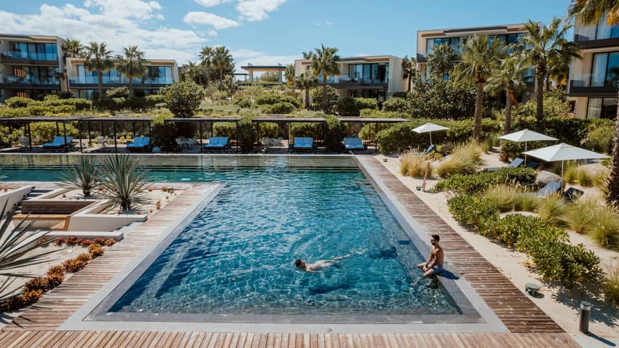 L-shaped resort pool in tropical location