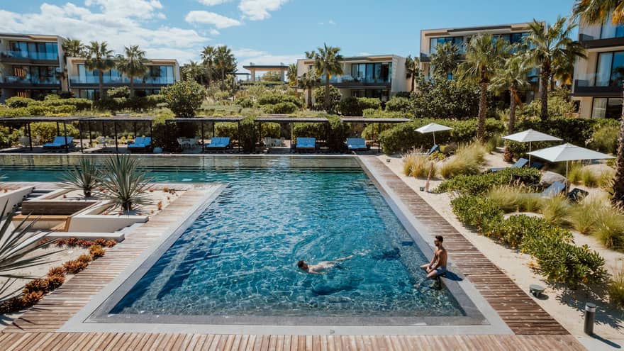 L-shaped resort pool in tropical location