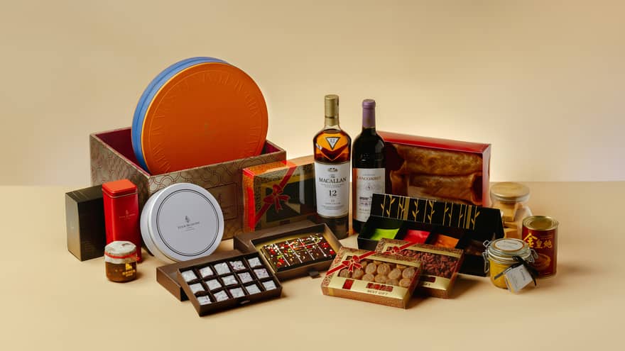A gourmet hamper gift set featuring mooncakes, sweets and two bottles of wine