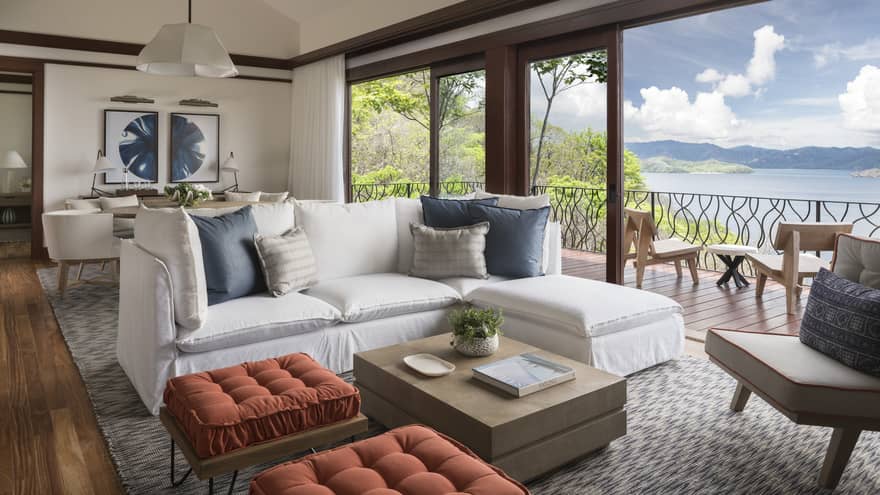 Three-Bedroom Residence Villa with Plunge Pool living room with white L-shaped sofa, ottomans by open patio door