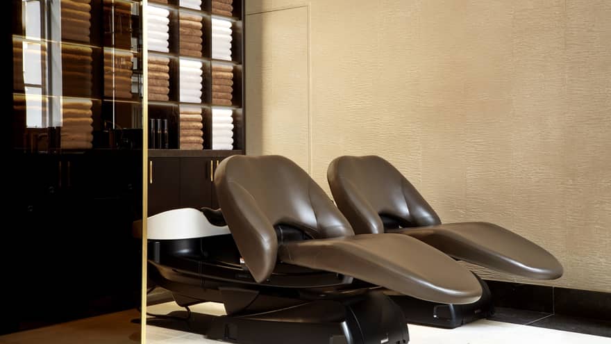 Gielly Green salon with warm-toned brown leather reclining chairs