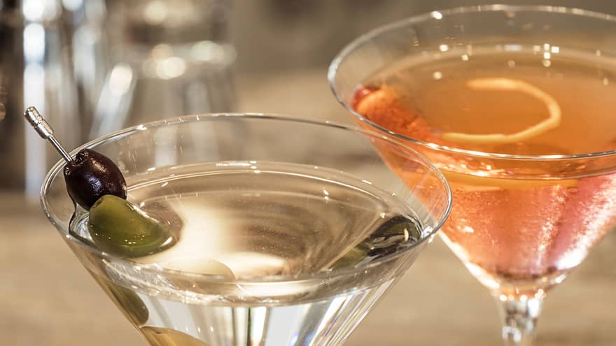 Two cocktails on a counter.
