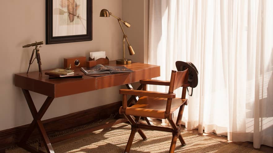 Presidential Villa wood desk with open magazine, brass lamp and telescope, leather chair 
