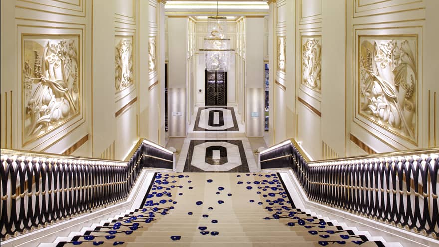View down marble Grand Staircase to hallway