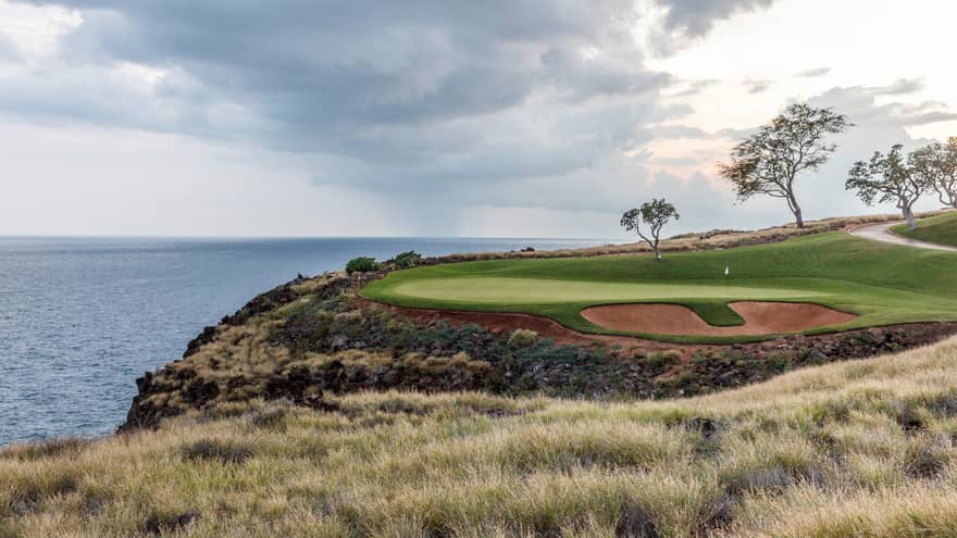 Manele Golf Course green on edge of cliff overlooking ocean