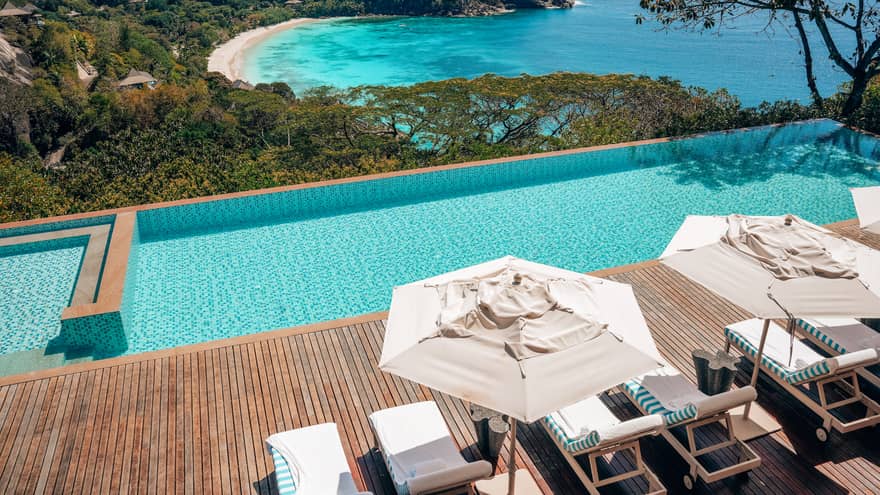 View of Private Residence pool and deck, with beach and ocean in the background