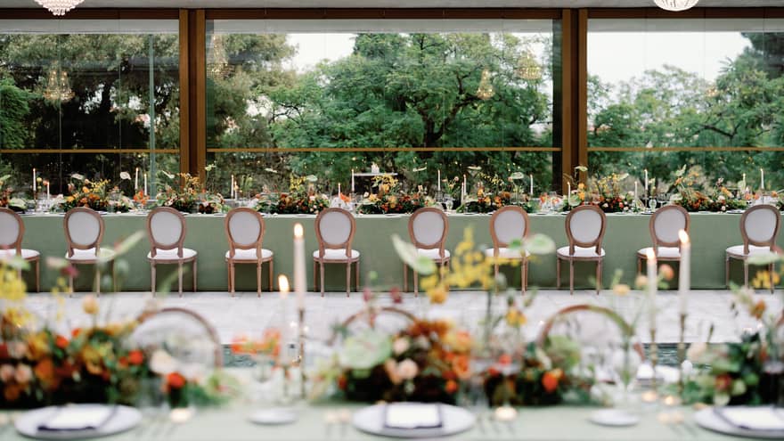 Long wedding table with a view of trees outside