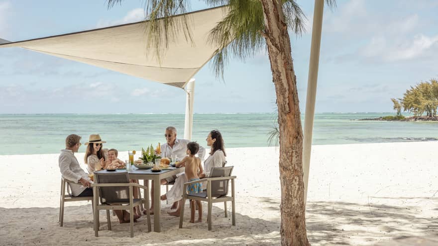 Family of six enjoys beachfront dining