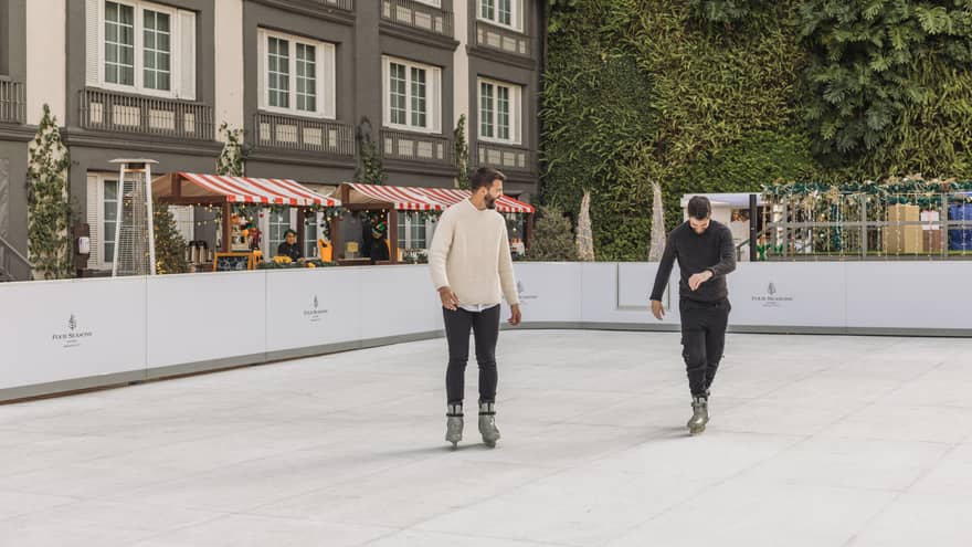 Two men iceskating.
