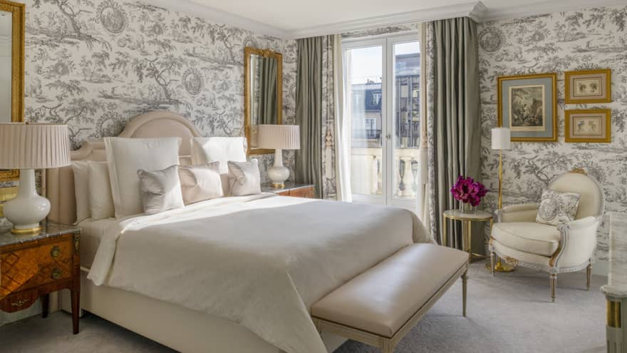 Grand Premier Suite bedroom with French wallpaper and king bed at Four Seasons Hotel George V, Paris