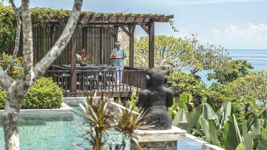Royal Villa infinity pool and outdoor dining area
