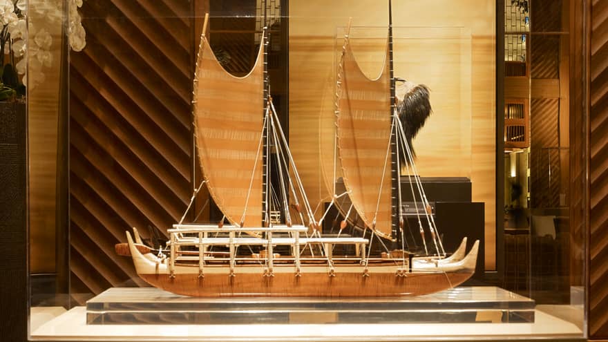 A sculpture of a boat in Four Seasons Resort Lanai's lobby