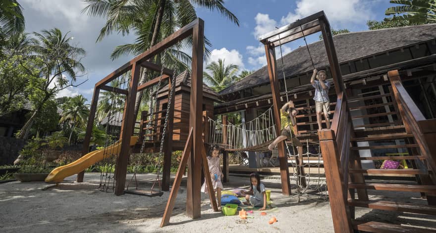 Kids playing on the play set in the kids club at Four Seasons Langkawi