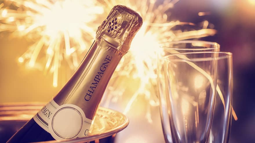 Fireworks, champagne and two champagne flutes