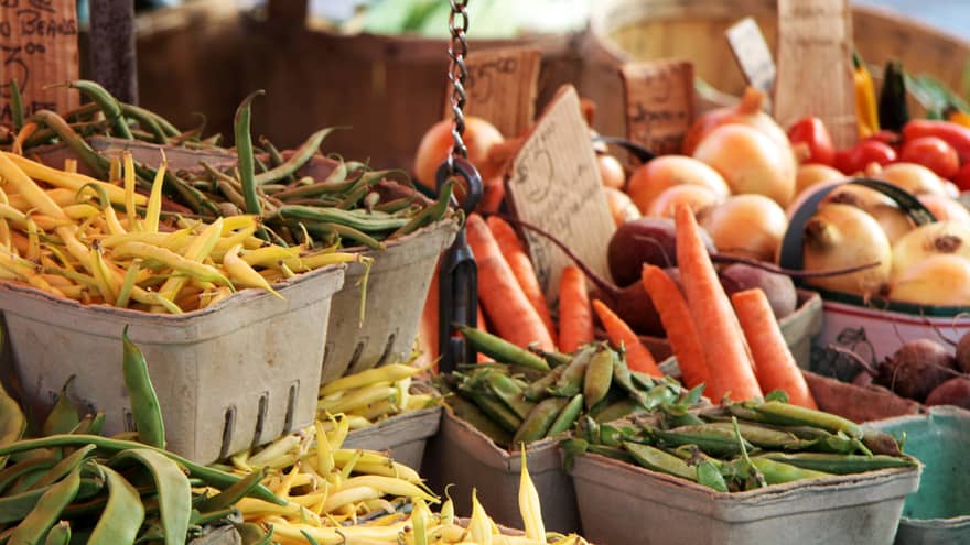 Fall vegetable bounty display at farmers market