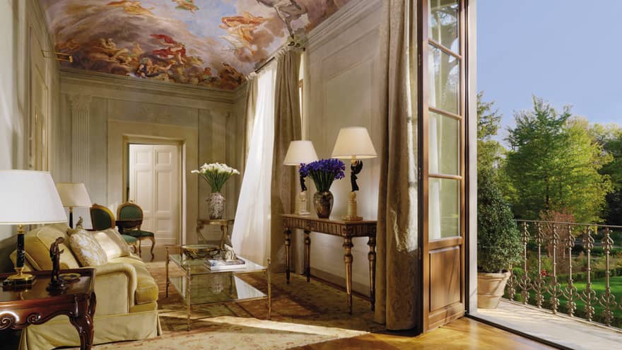 Presidential Suite sitting area under mural panel ceiling, open balcony door