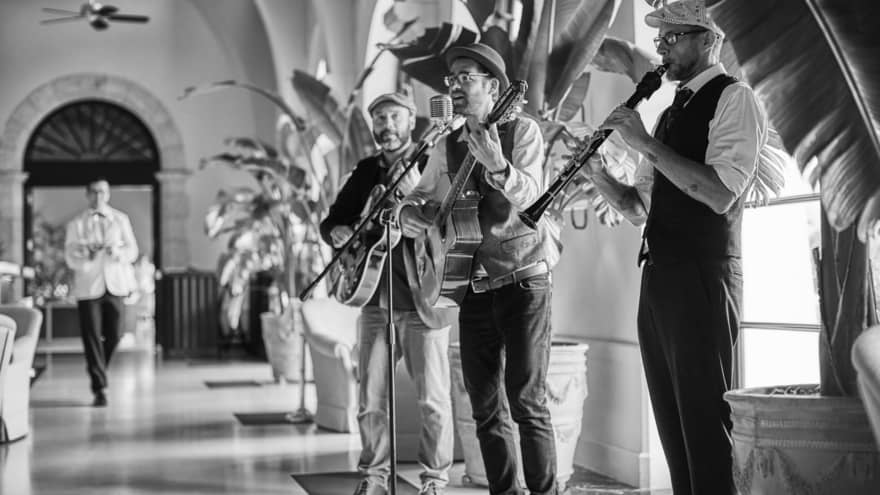 A live band playing guitars and clarinets.