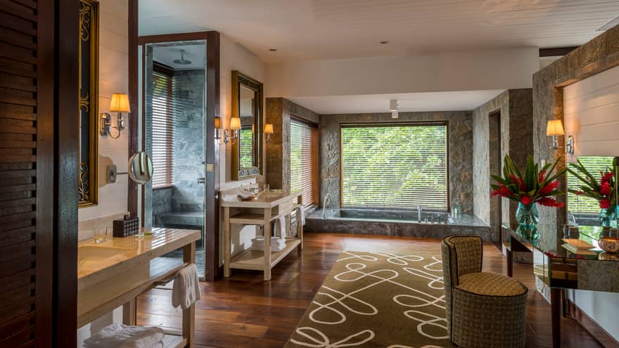 Four-Bedroom Residence Villa large bathroom with walk-in rain shower, sunken marble tub by window