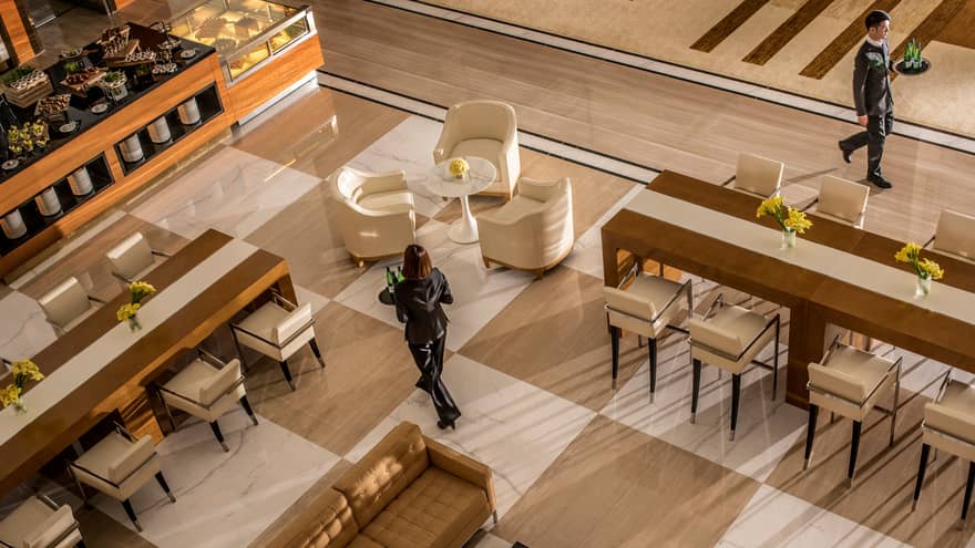 Aerial view of hotel staff walking through Foyer lounge seating areas