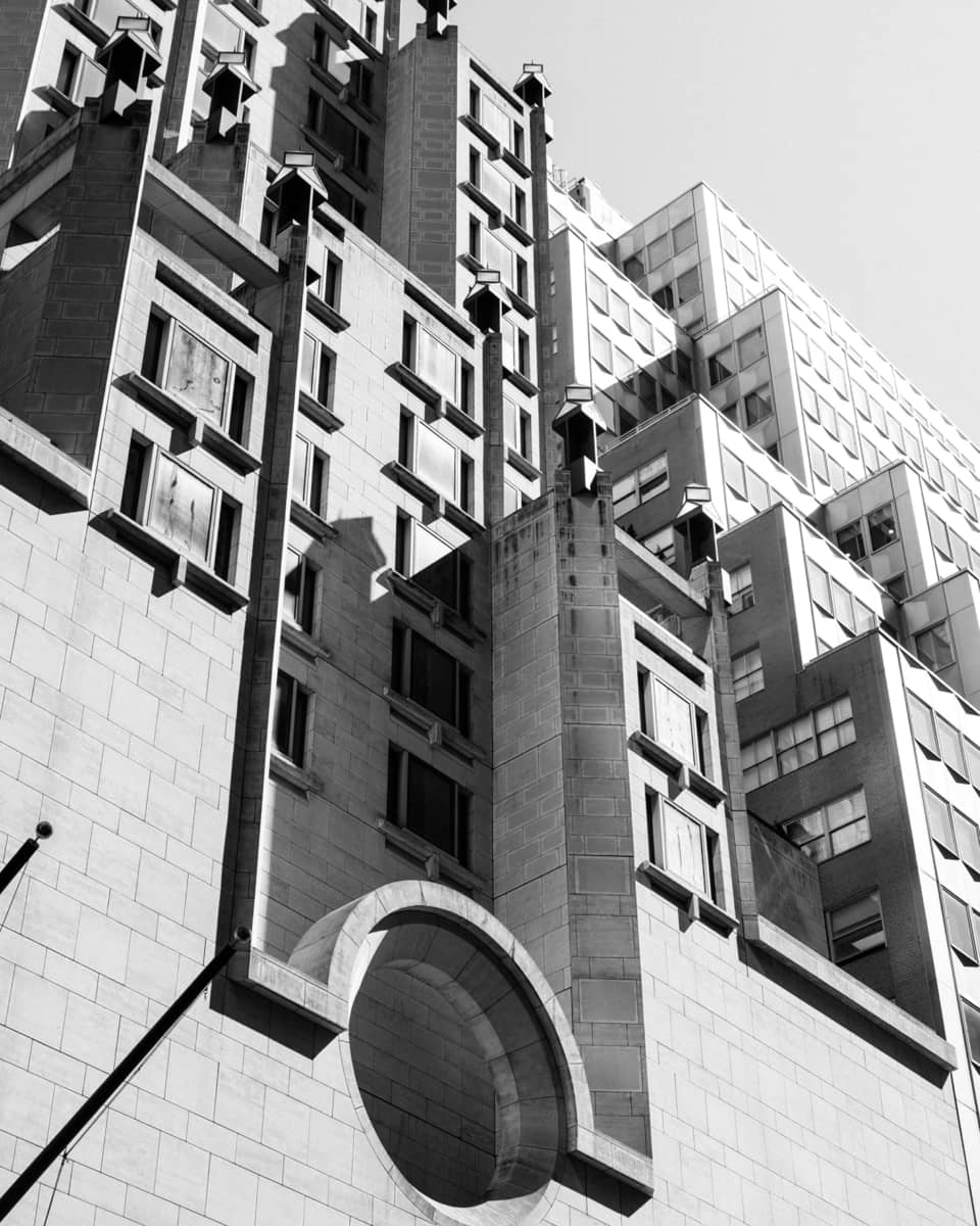 A large building with many dimensions and windows.