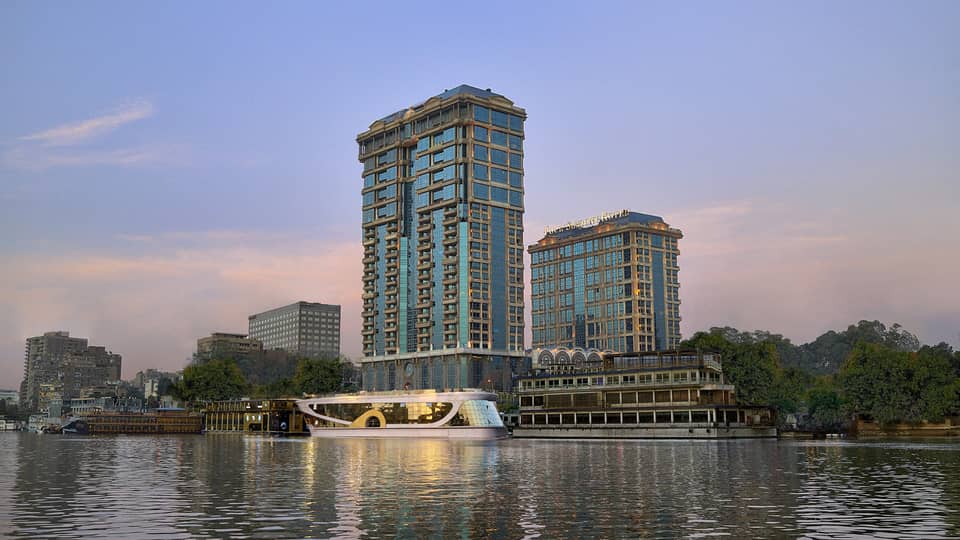 Cairo at the First Residence exterior illuminated at sunset