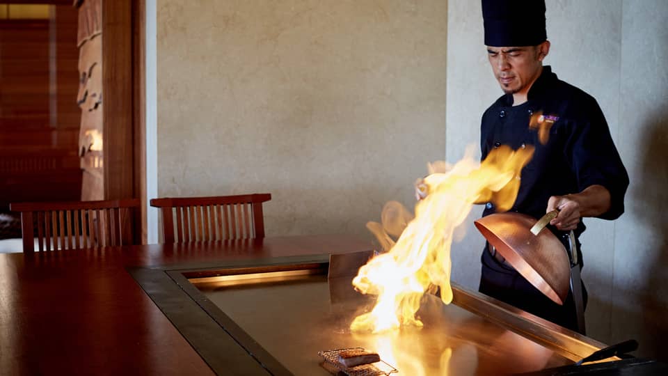 Flames shoot up from grill as NOBU restaurant chef pulls back copper lid