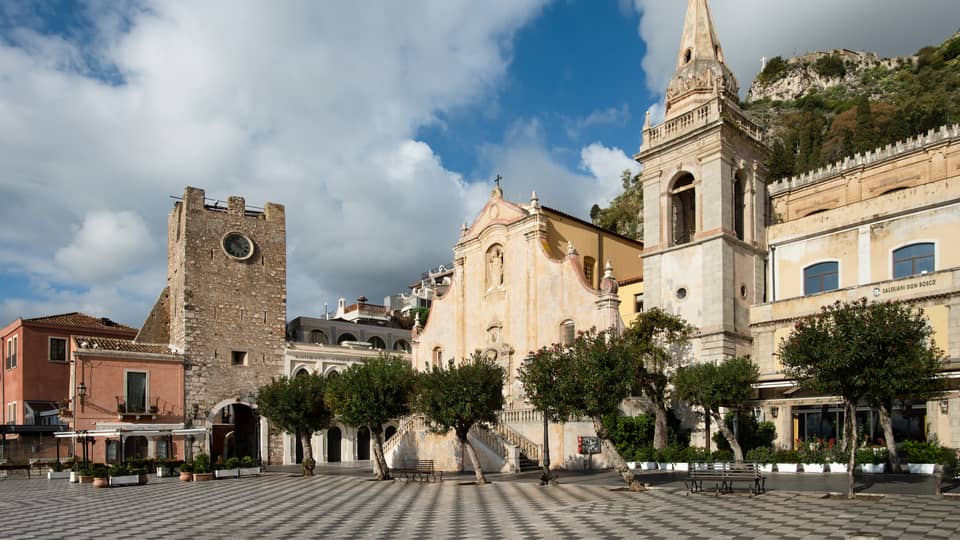 Piazza IX Aprile, photographed from a low angle on the tiled ground, in Taormina, Sicily